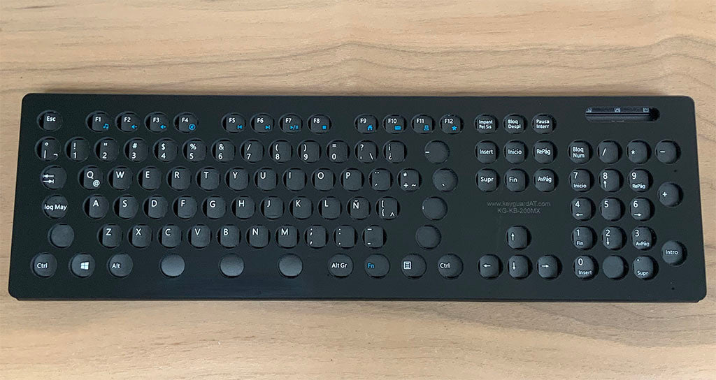 VSeven Multimedia Keyboard Keyguard with round openings.